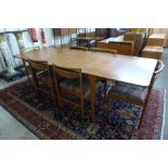 A McIntosh teak T3 model double leaf extending dining table and six chairs
