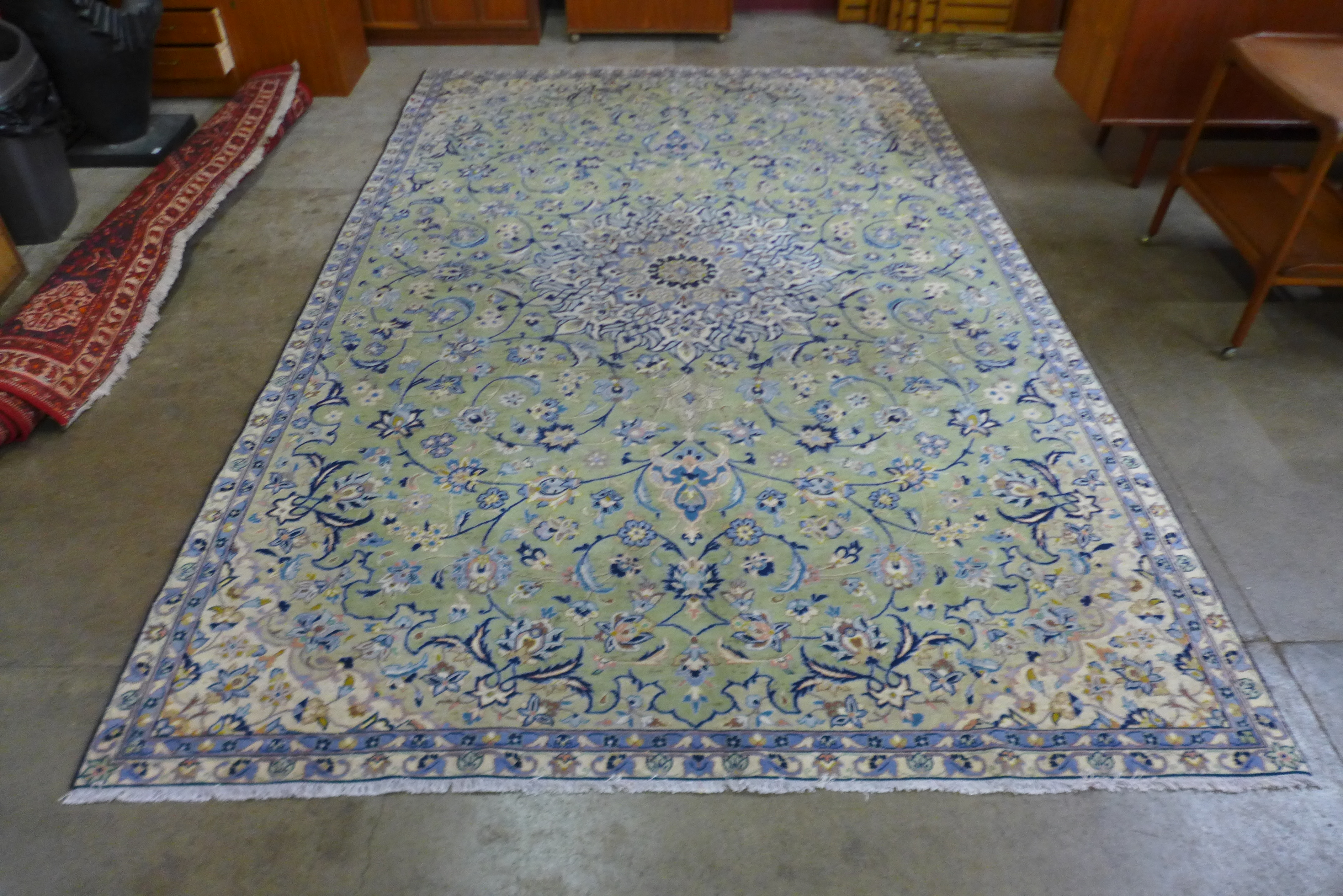 A Persian hand knotted wool mint green ground Isfahan rug