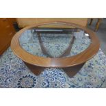 A G-Plan Astro teak and glass topped circular coffee table