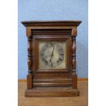 A 19th Century German carved oak mantel clock
