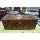 A small oriental carved camphorwood box