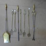 A brass companion set and five toasting forks