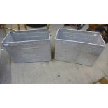 A pair of vintage aluminium Wall's Ice Cream crates