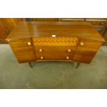 A Uniflex tola wood sideboard