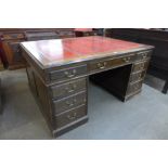 A George III style mahogany and red leather topped partners desk