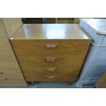 A teak chest of drawers