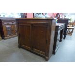 An Edward VII oak two door enclosed bookcase