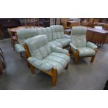 A Norwegian Ekornes elm and leather upholstered three piece suite