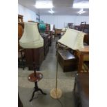 A mahogany standard lamp and a brass standard lamp