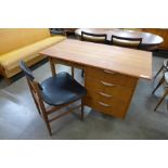 A teak desk and chair