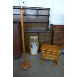 A teak standard lamp, nest of tables and a teak framed mirror