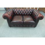 An oxblood leather Chesterfield settee