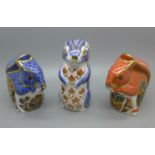 Three Royal Crown Derby Paperweights - Debenhams Squirrel with gold stopper and original box, Red