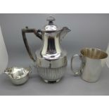 Three silver plated items, two jugs and a mug and a Colibri lighter