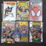 A collection of comics including Spiderman, Wolverine, etc.