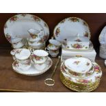 A set of Royal Albert Old Country Roses and two boxes of unused matching forks and spoons,