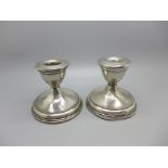 A pair of sterling silver weighted candle holders, Otto Reichhardt, New York, USA, circa 1940, a/