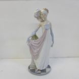 A tall Lladro Hand Painted Porcelain Figure ' Socialite of the 20's ' Model No 5283, issued 1985 -
