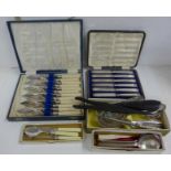 A cased set of six silver handled knives, fish knives and forks, two button hooks and a shoe horn