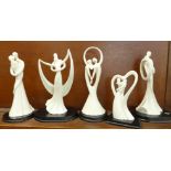 A collection of Blanc de Chine figures on plinths, circle of love theme