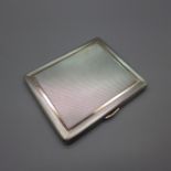 A silver cigarette case with gold detail, inside bears inscription dated 1938, 186g, 83mm x 101mm