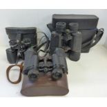 A collection of binoculars and cases