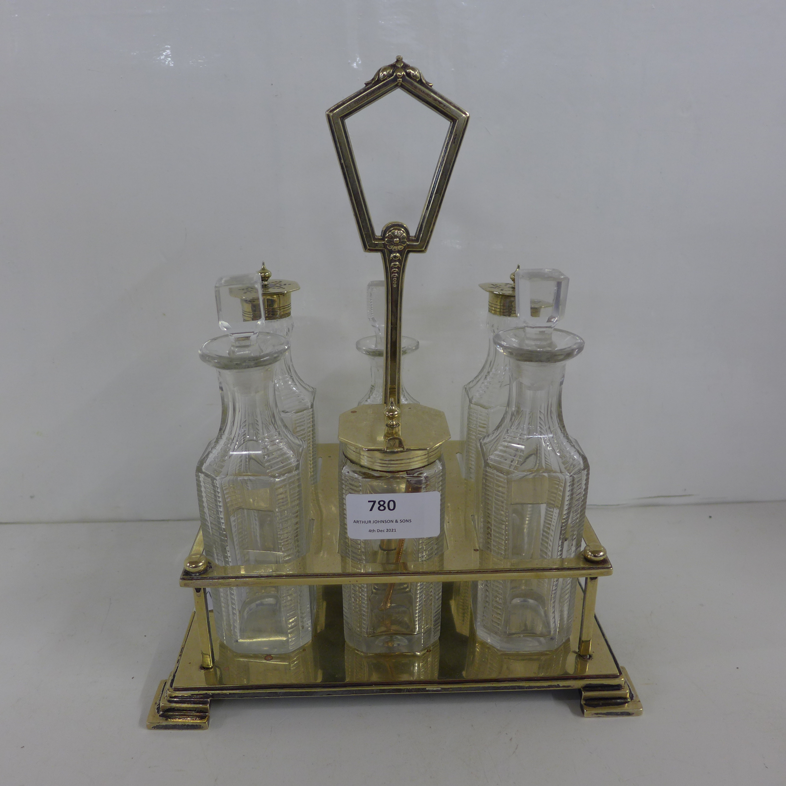 A six-bottle Art Deco cut glass and EPNS framed cruet with all original bottles
