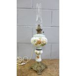 A glass floral pattern oil lamp