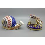 A Royal Crown Derby snail paperweight and a frog paperweight with silver stoppers