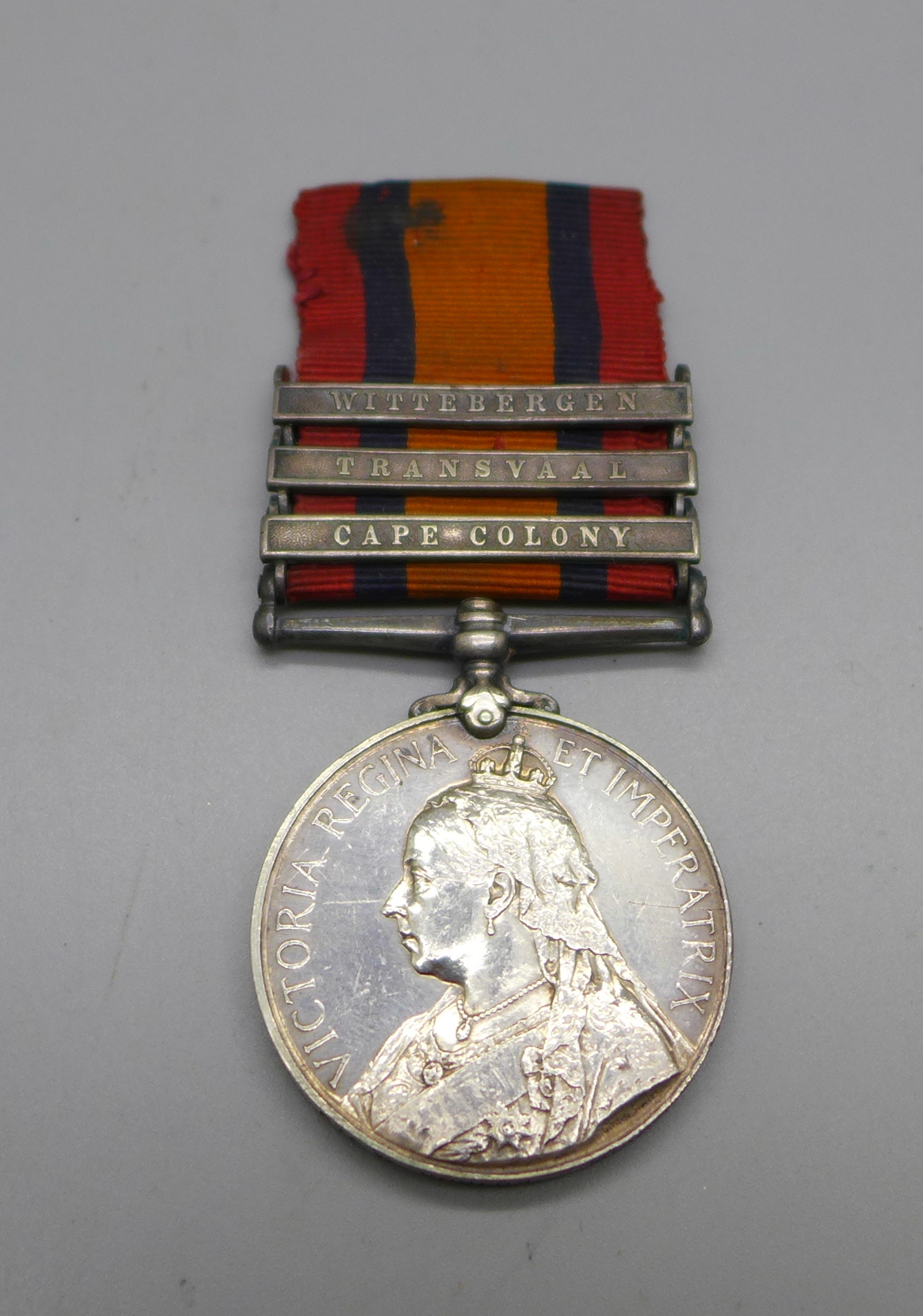 A Queen's South Africa medal with three clasps, to 3117 Pte. W. Rogers, Munster Fus., re-named