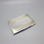 A silver card case with initials and 14ct gold detail, marked 14ct gold & sterling, also marked