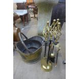 A Victorian brass coal scuttle and andirons