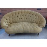 A Victorian mahogany and buttoned fabric upholstered settee