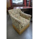 A Victorian Howard style fabric upholstered country house armchair