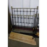 A Victorian wrought iron and brass double bed