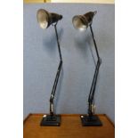 Two Herbert Terry & Sons Ltd. black metal anglepoise desk lamps