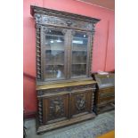 A 19th Century French carved oak bookcase, 243cms h, 142cms w, 56cms d