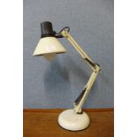 A white metal anglepoise desk lamp