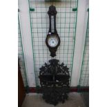 A Black Forest style wall bracket and an aneroid barometer