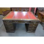 A George III style mahogany and red leather topped partners desk