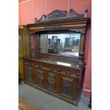 An Art Nouveau carved walnut mirrorback sideboard