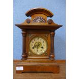 A 19th Century German carved oak mantel clock