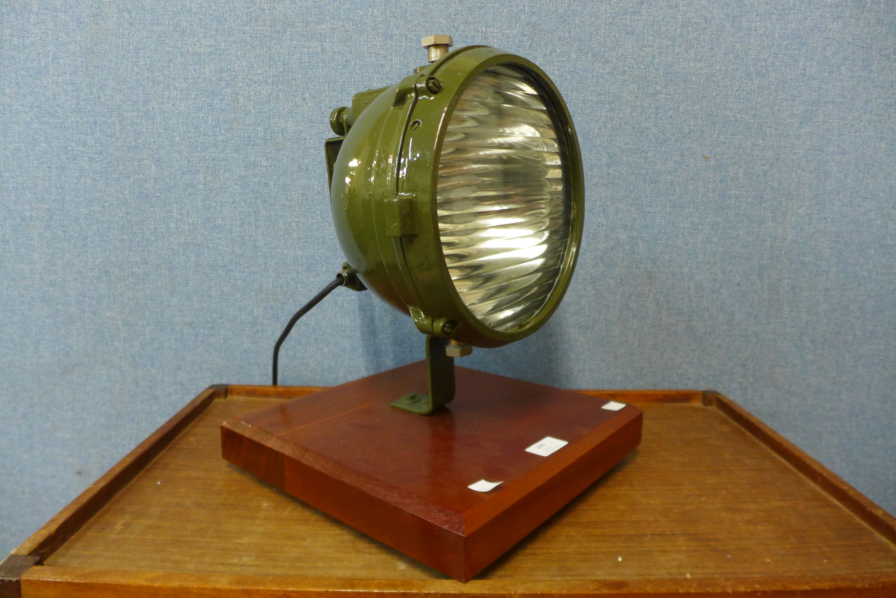 A Vintage green metal spotlight on stand