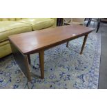 A teak and black lacquered drop leaf coffee table