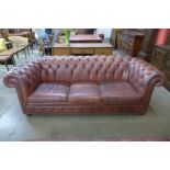 A burgundy leather Chesterfield settee