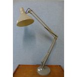 A large grey metal anglepoise desk lamp