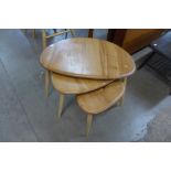 An Ercol Blonde elm and beech pebble shaped nest of tables