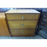 A teak chest of drawers