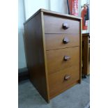 A teak chest of drawers