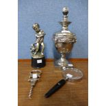 An early 20th Century white metal table lamp, a table lighter, a magnifying glass and a corkscrew